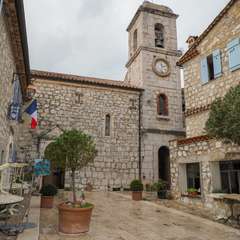 Main square and cathedral in the village of Gourdon